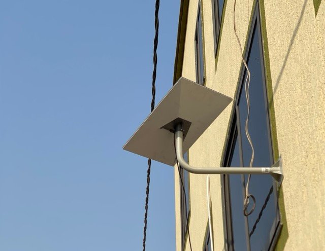 Technician setting up a Starlink internet system